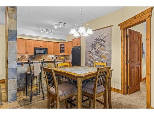 112-175 Crossbow Place, Canmore, AB - Indoor Photo Showing Dining Room