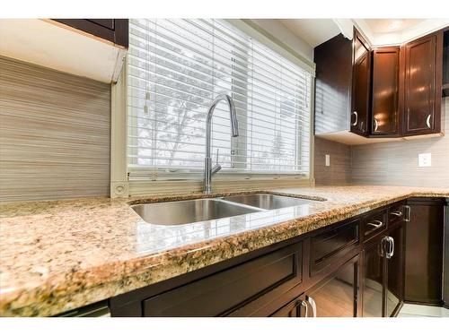 79 Abalone Way Ne, Calgary, AB - Indoor Photo Showing Kitchen With Double Sink