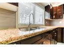 79 Abalone Way Ne, Calgary, AB  - Indoor Photo Showing Kitchen With Double Sink 