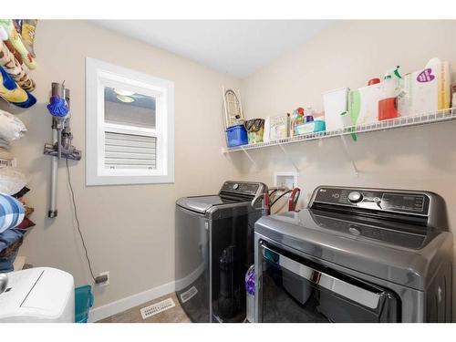 5 Morgan Street, Cochrane, AB - Indoor Photo Showing Laundry Room