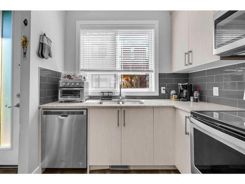 706 Redstone Crescent Ne, Calgary, AB - Indoor Photo Showing Kitchen With Double Sink