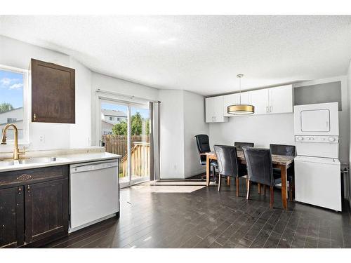 210 Saratoga Close Ne, Calgary, AB - Indoor Photo Showing Kitchen With Double Sink