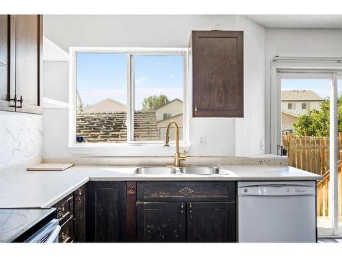 210 Saratoga Close Ne, Calgary, AB - Indoor Photo Showing Kitchen With Double Sink