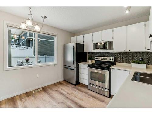 637 Queensland Place Se, Calgary, AB - Indoor Photo Showing Kitchen With Stainless Steel Kitchen With Double Sink