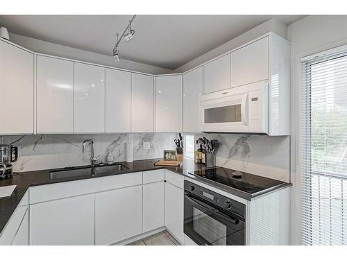 2308 16A Street Sw, Calgary, AB - Indoor Photo Showing Kitchen With Double Sink