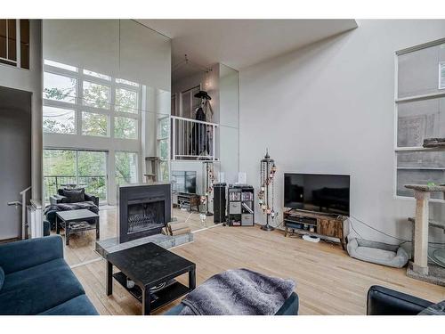 2308 16A Street Sw, Calgary, AB - Indoor Photo Showing Living Room With Fireplace