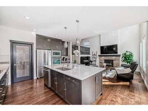 25 Aspen Summit Manor Sw, Calgary, AB - Indoor Photo Showing Kitchen With Fireplace With Upgraded Kitchen