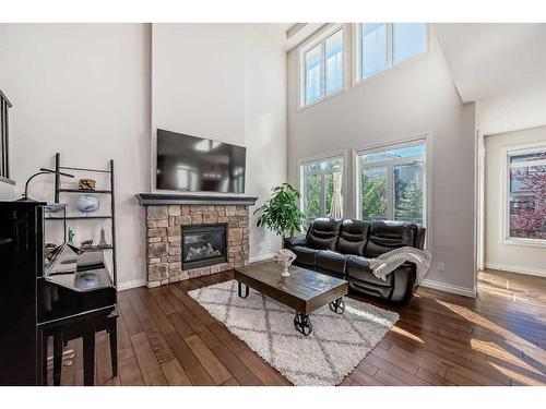 25 Aspen Summit Manor Sw, Calgary, AB - Indoor Photo Showing Living Room With Fireplace