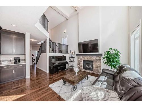 25 Aspen Summit Manor Sw, Calgary, AB - Indoor Photo Showing Living Room With Fireplace