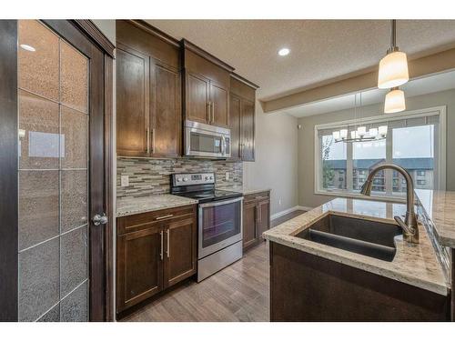 104 Sherwood Square Nw, Calgary, AB - Indoor Photo Showing Kitchen With Double Sink With Upgraded Kitchen