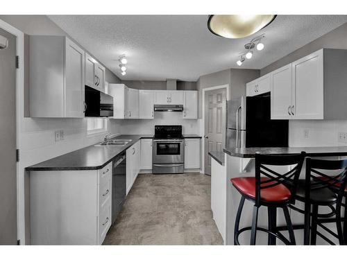 808 Prairie Sound Circle Nw, High River, AB - Indoor Photo Showing Kitchen With Double Sink