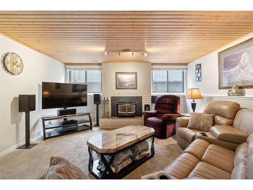 364 Silvergrove Place Nw, Calgary, AB - Indoor Photo Showing Living Room With Fireplace