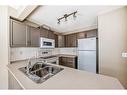 53 Eversyde Court Sw, Calgary, AB  - Indoor Photo Showing Kitchen With Double Sink 