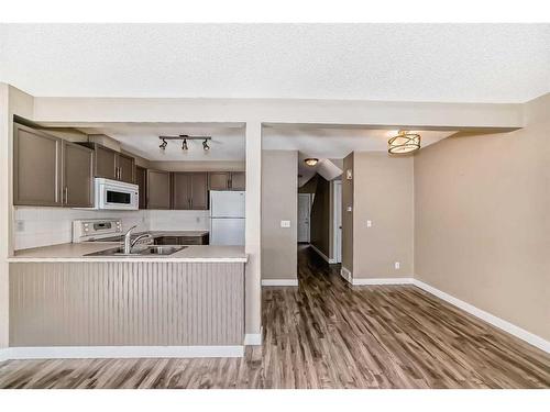 53 Eversyde Court Sw, Calgary, AB - Indoor Photo Showing Kitchen With Double Sink