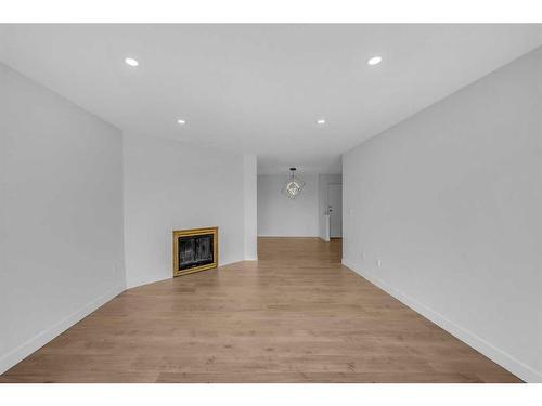 213-335 Garry Crescent Ne, Calgary, AB - Indoor With Fireplace