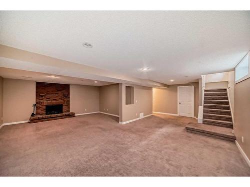 10816 Shamrock Place Sw, Calgary, AB - Indoor With Fireplace