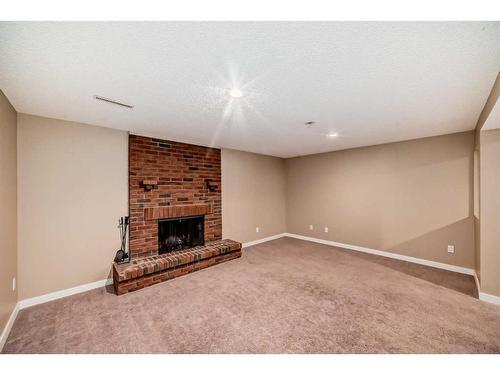 10816 Shamrock Place Sw, Calgary, AB - Indoor With Fireplace