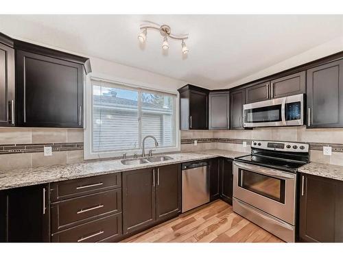 10816 Shamrock Place Sw, Calgary, AB - Indoor Photo Showing Kitchen With Double Sink