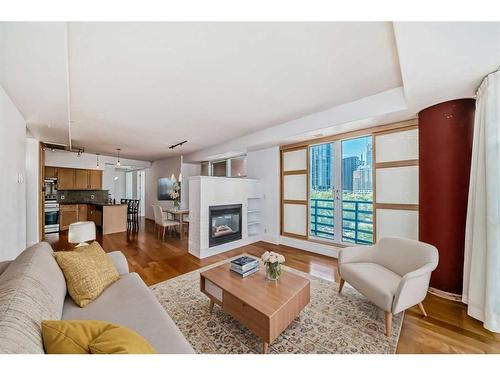 401-205 Riverfront Avenue Sw, Calgary, AB - Indoor Photo Showing Living Room With Fireplace