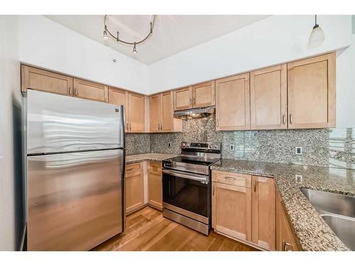 401-205 Riverfront Avenue Sw, Calgary, AB - Indoor Photo Showing Kitchen With Stainless Steel Kitchen With Double Sink