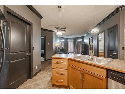 109-15304 Bannister Road Se, Calgary, AB - Indoor Photo Showing Kitchen With Double Sink