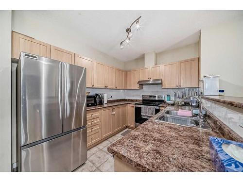 1215-333 Taravista Drive Ne, Calgary, AB - Indoor Photo Showing Kitchen With Double Sink