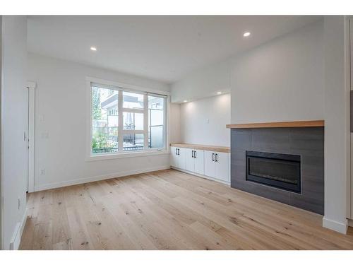 3209 16 Street Sw, Calgary, AB - Indoor Photo Showing Living Room With Fireplace