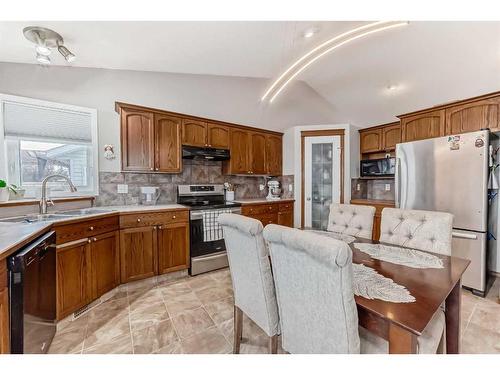 108 High Ridge Place Nw, High River, AB - Indoor Photo Showing Kitchen With Double Sink