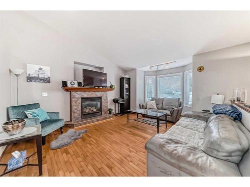 108 High Ridge Place Nw, High River, AB - Indoor Photo Showing Living Room With Fireplace