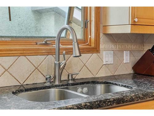 105 Coral Shores Bay Ne, Calgary, AB - Indoor Photo Showing Kitchen With Double Sink