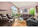 105 Coral Shores Bay Ne, Calgary, AB  - Indoor Photo Showing Living Room 