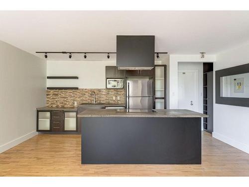 304-2137 16 Street Sw, Calgary, AB - Indoor Photo Showing Kitchen With Stainless Steel Kitchen With Double Sink