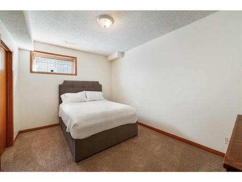 25 Patterson Park Sw, Calgary, AB - Indoor Photo Showing Bedroom