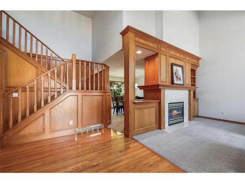 25 Patterson Park Sw, Calgary, AB - Indoor Photo Showing Other Room With Fireplace