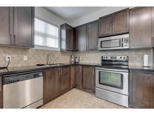 206-88 Arbour Lake Road Nw, Calgary, AB - Indoor Photo Showing Kitchen With Stainless Steel Kitchen With Upgraded Kitchen