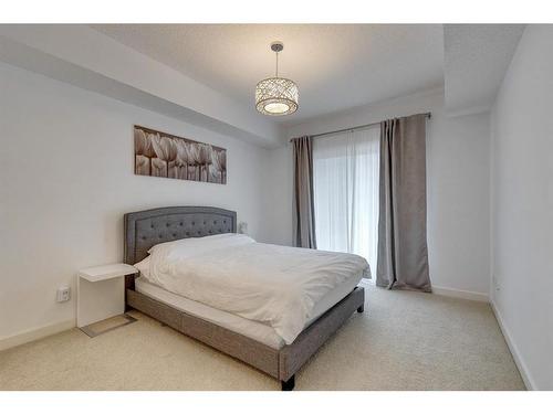 206-88 Arbour Lake Road Nw, Calgary, AB - Indoor Photo Showing Bedroom