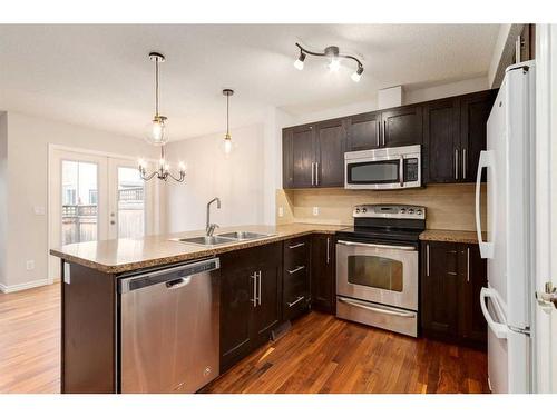 803-2384 Sagewood Gate Sw, Airdrie, AB - Indoor Photo Showing Kitchen With Double Sink