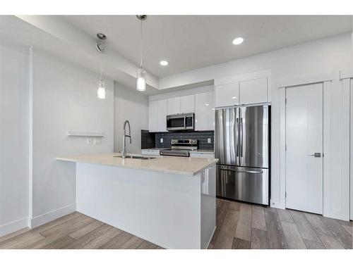 19645 48 Street Se, Calgary, AB - Indoor Photo Showing Kitchen With Double Sink