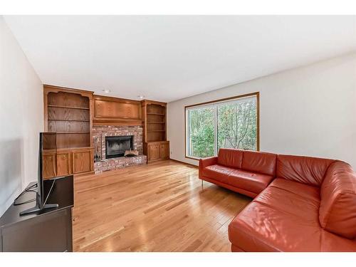 96 Edgepark Road Nw, Calgary, AB - Indoor Photo Showing Living Room With Fireplace