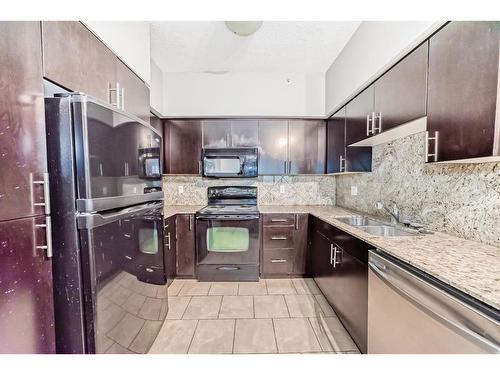 1607-8710 Horton Road Sw, Calgary, AB - Indoor Photo Showing Kitchen With Double Sink