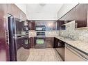 1607-8710 Horton Road Sw, Calgary, AB  - Indoor Photo Showing Kitchen With Double Sink 