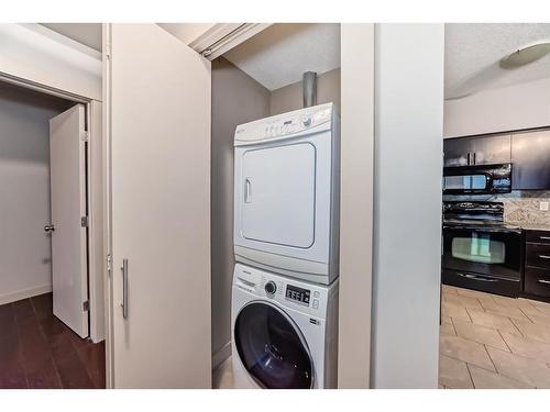 1607-8710 Horton Road Sw, Calgary, AB - Indoor Photo Showing Laundry Room