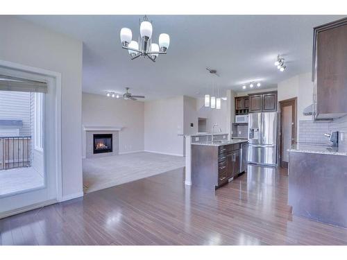 446 Sherwood Place Nw, Calgary, AB - Indoor Photo Showing Kitchen With Fireplace