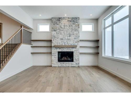 92 Cimarron Estates Drive, Okotoks, AB - Indoor Photo Showing Other Room With Fireplace