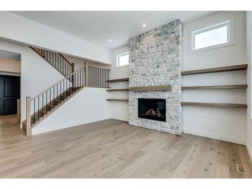 92 Cimarron Estates Drive, Okotoks, AB - Indoor Photo Showing Living Room With Fireplace