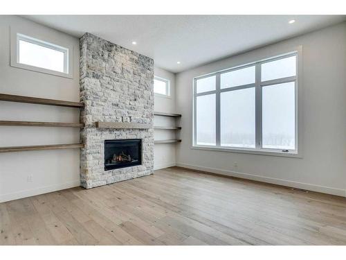 92 Cimarron Estates Drive, Okotoks, AB - Indoor Photo Showing Living Room With Fireplace