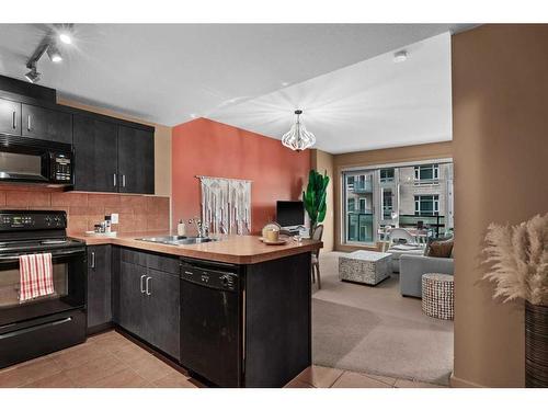 708-1410 1 Street Se, Calgary, AB - Indoor Photo Showing Kitchen With Double Sink