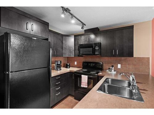 708-1410 1 Street Se, Calgary, AB - Indoor Photo Showing Kitchen With Double Sink