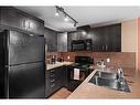 708-1410 1 Street Se, Calgary, AB  - Indoor Photo Showing Kitchen With Double Sink 