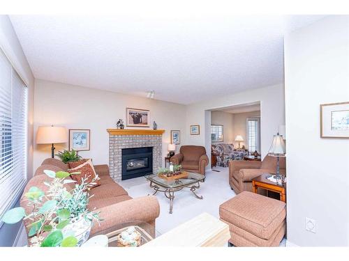 1218 Millview Drive Sw, Calgary, AB - Indoor Photo Showing Living Room With Fireplace